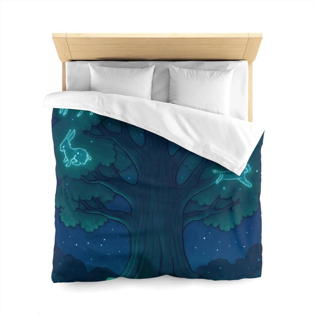 Housse de couette étoilée avec animaux lumineux sous un grand arbre mystique